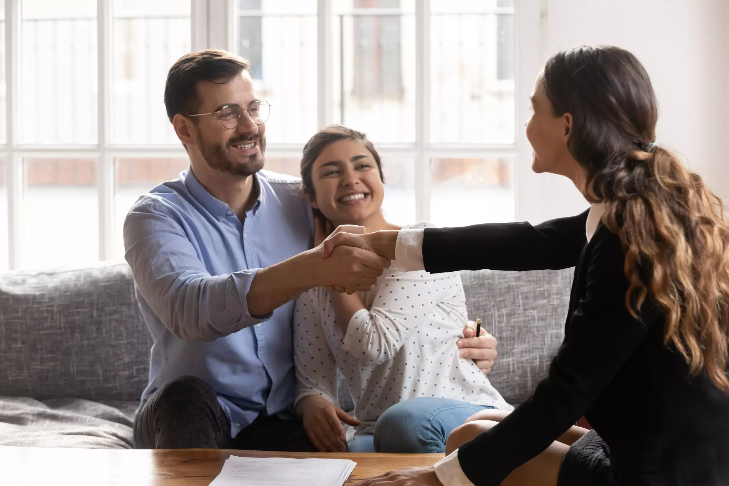 A realtor working with a young couple